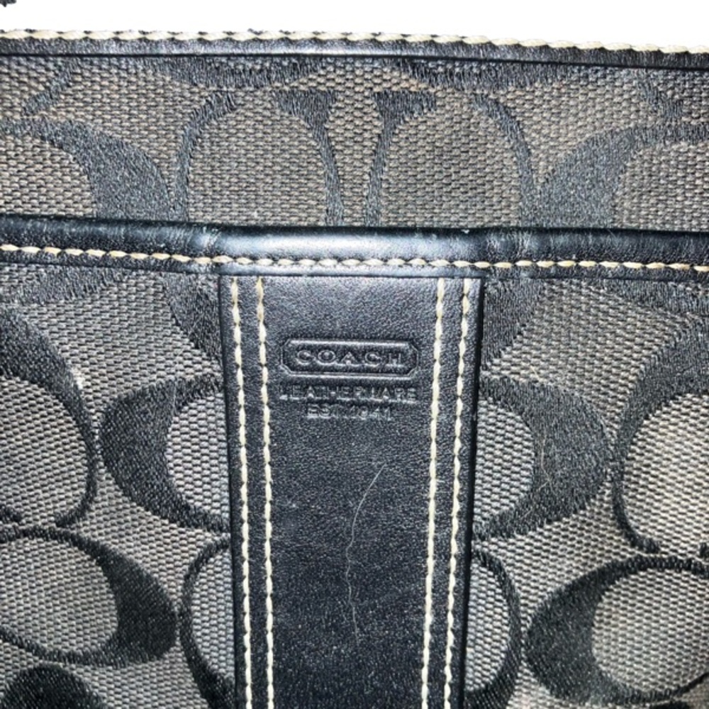 Black small coach light handbag.